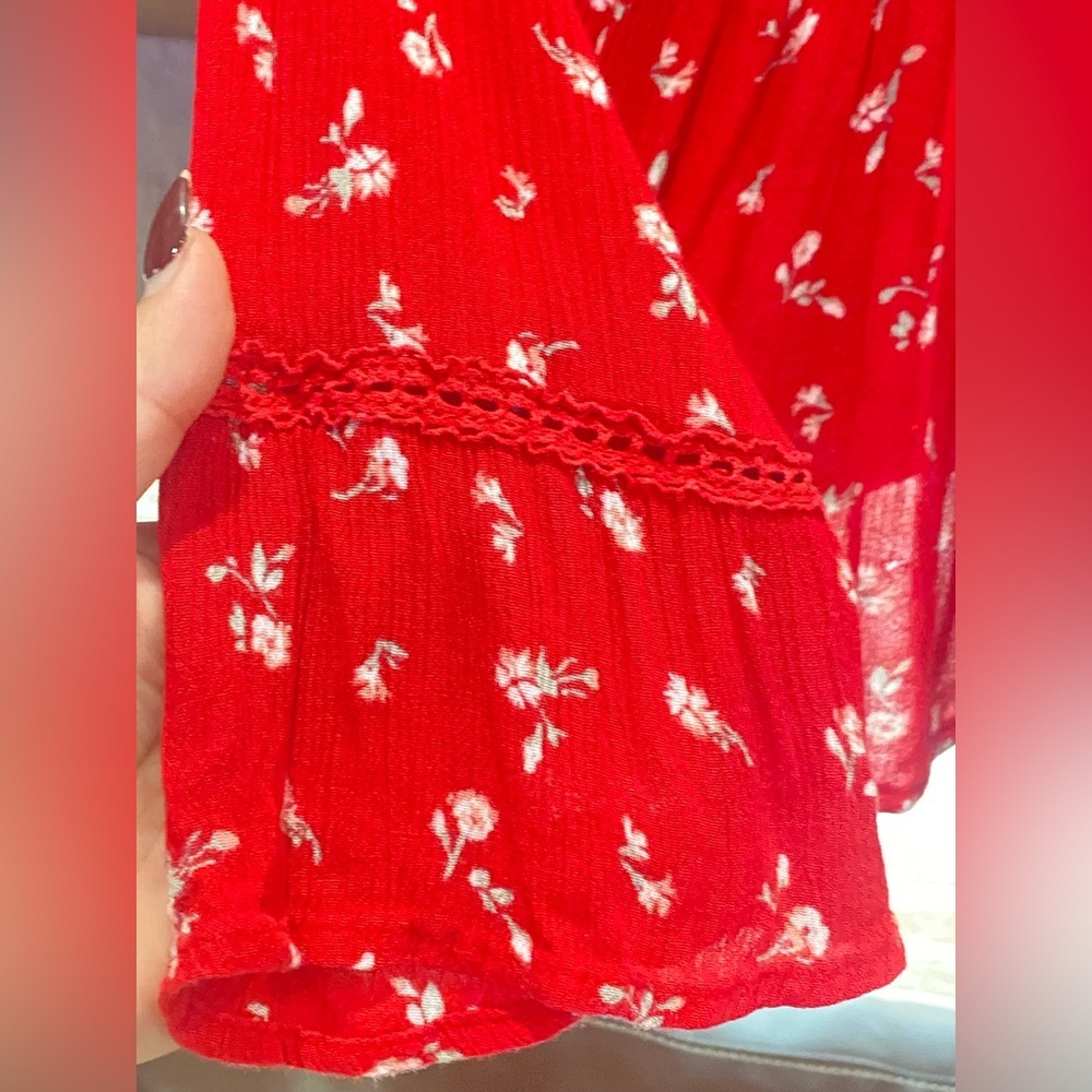 4/$25*Hollister, featuring a V-neck, peplum hem, and long flared sleeves. L - Picture 6 of 7